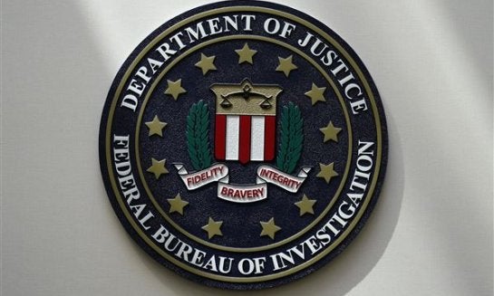 An FBI seal is seen on a wall, Aug. 10, 2022, in Omaha, Neb.