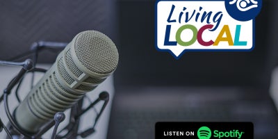 photo of microphone with living local logo and listen on spotify logo