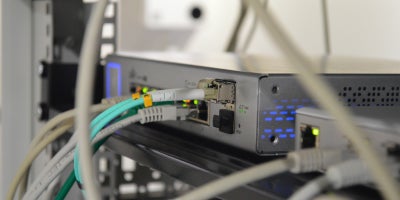 photo of back of router with cords and lights displayed