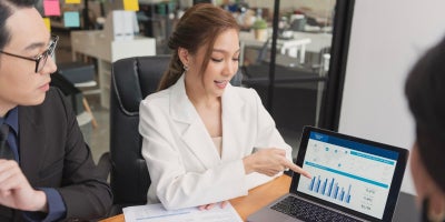 digital transformation, finance industry blog, woman showing statistics to client