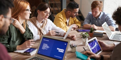 Business Internet, meeting between coworkers, ensure peak internet usage with tips