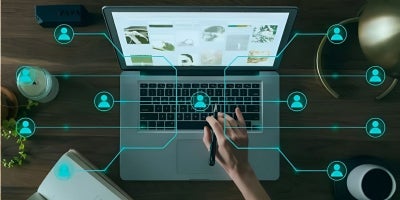 photo of laptop from above with overlay of interconnected network