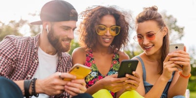 buckeye blog, summer internet usage, 3 friends smiling in the sun on phones