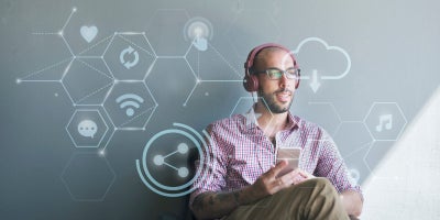 buckeye blog, intelligent routing, ai intelligent routing, man with headphones surrounded by images of Internet