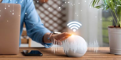 smart home devices, smart home basics, woman using smart home device