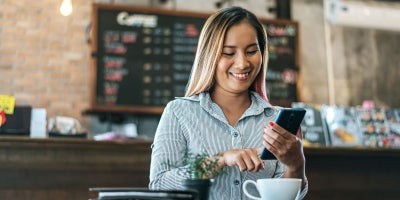 business wifi, free guest wifi, customer wifi, woman in cafe on phone