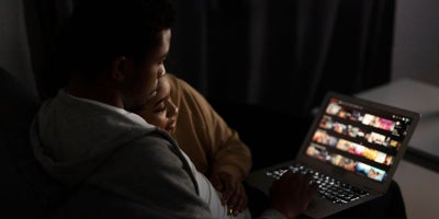 choosing a streaming service, streaming tv, couple watching streaming service