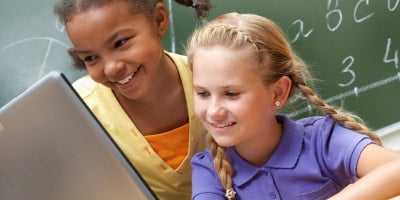 back to school safety, kids parental controls, bark, two kids on laptop at school