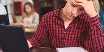 school wifi issues, upset student on laptop