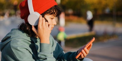 childs first phone, teen on phone, what age to get a phone