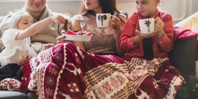 indoor activities for cold weather, family with christmas blanket