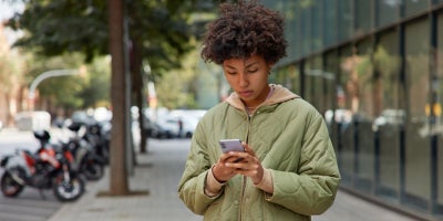 how to change your phone number, woman on phone