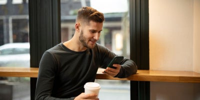 stream tv, out of home streaming, man in cafe