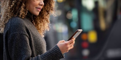 what is a mobile hotspot, how does a hotspot work, woman on phone outside