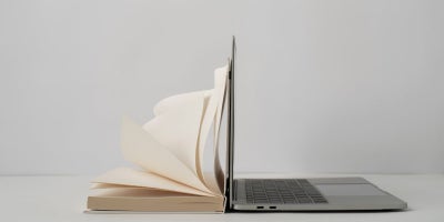 internet archive, wayback machine, image of book laying on laptop