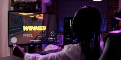 mbps for gaming, girl winning a online game, high speed internet