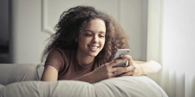 Person using a mobile phone after switching carriers