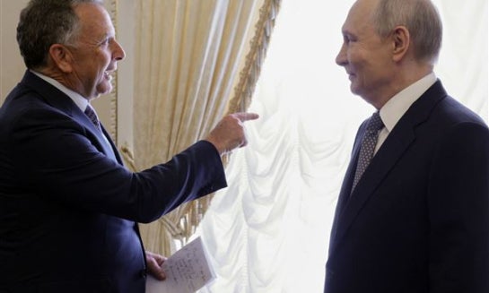 Russian President Vladimir Putin, left, and U.S. President Donald Trump's special envoy Steve Witkoff, second right, attend the talks, as Russian Presidential Envoy Kirill Dmitriev, right back to a camera, and Kremlin foreign policy adviser Yuri Ushakov, 