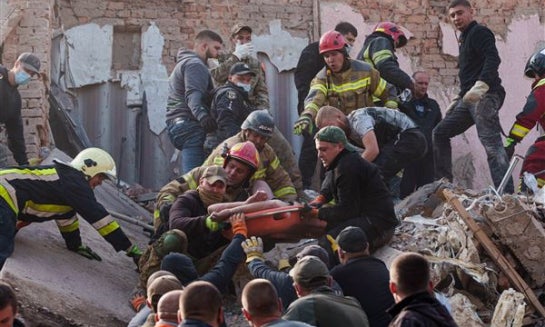 Rescuers work on the scene of a building destroyed following recent Russian attacks Oct. 7 in Pryluky, Chernihiv region, Ukraine.