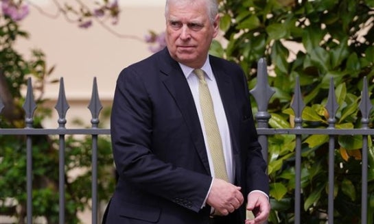 Prince Andrew looks round as he leaves after attending the Easter Matins Service at St. George's Chapel, Windsor Castle on April 20.