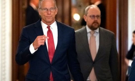Senate Majority Leader John Thune, of S.D., walks toward his office from the Senate chamber at the Capitol July 16 in Washington.