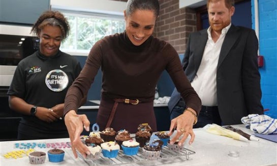 Britain's Prince Harry and Meghan, Duke and Duchess of Sussex visit Epic Partners in Nottingham, England on Oct. 15.