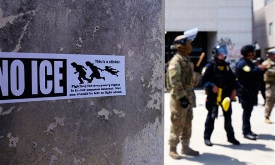 DHS police and National Guard protect the outside the Metropolitan Detention Center, on June 11 in Los Angeles.