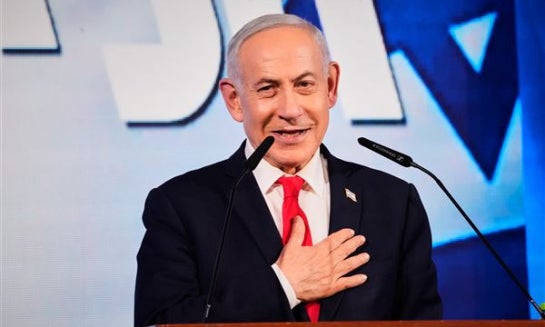 Israeli Prime Minister Benjamin Netanyahu speaks to his supporters at Likud party headquarters in Jerusalem after the release of the first exit poll results in Israel's general election, Oct. 28.
