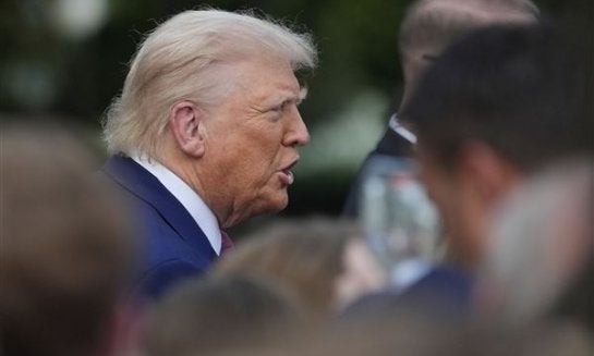 President Donald Trump greets guests during the congressional picnic on the South Lawn of the White House on June 12 in Washington.