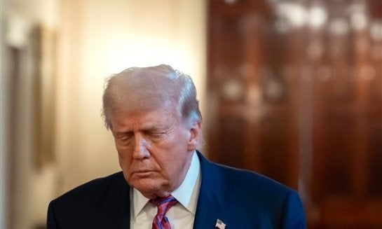 President Donald Trump arrives for an event to sign the GENIUS Act, a bill that regulates stablecoins, a type of cryptocurrency, in the East Room of the White House on July 18.