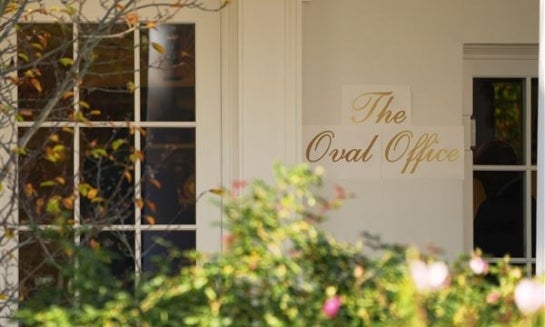 A sign is seen outside the Oval Office before President Donald Trump walks out to board Marine One on the South Lawn of the White House on Nov. 5.