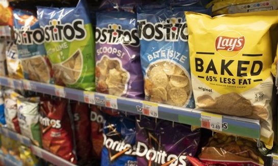 Potato chips are displayed at a store in New York, March 25, 2021.