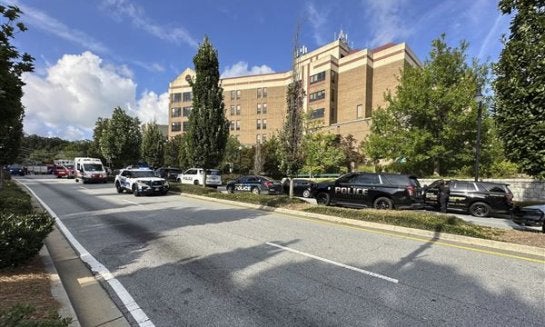 Emergency vehicles line up near Emory University and Centers for Disease Control and Prevention headquarters in Atlanta on Aug. 8