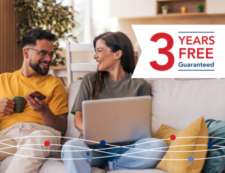 Photo of people using laptop and a banner that reads '3 Years Free Guaranteed'
