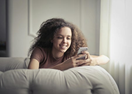 Person using a mobile phone after switching carriers