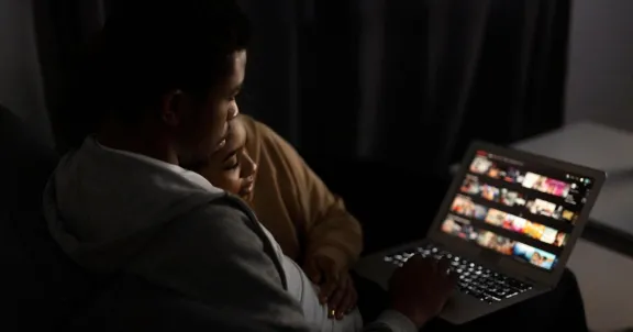 choosing a streaming service, streaming tv, couple watching streaming service