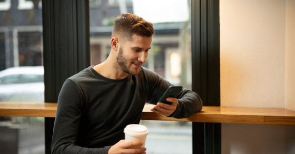 stream tv, out of home streaming, man in cafe