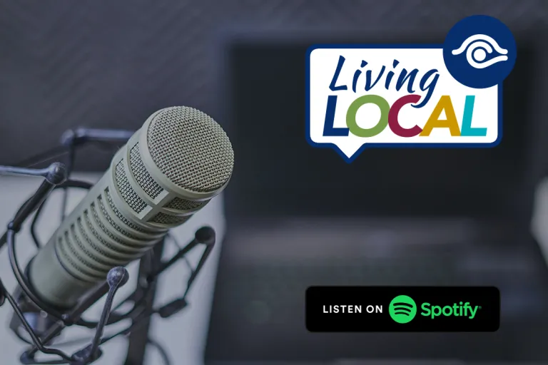 photo of microphone with living local logo and listen on spotify logo