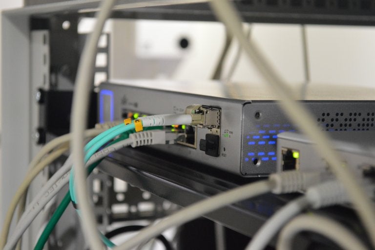 photo of back of router with cords and lights displayed
