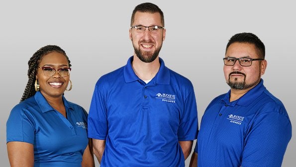 3 Members of the Buckeye Team wearing blue shirts