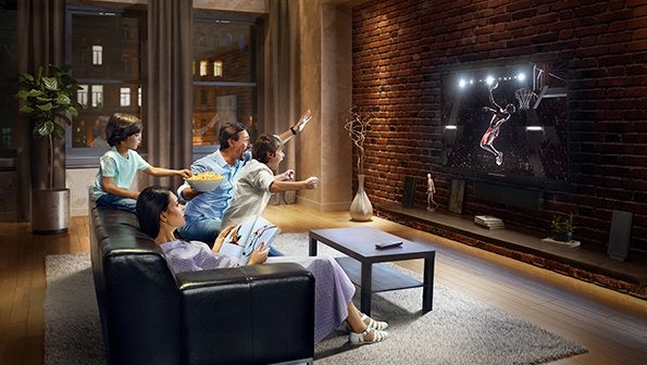 Family cheering while watching basketball, live sports streaming, sports tv streaming