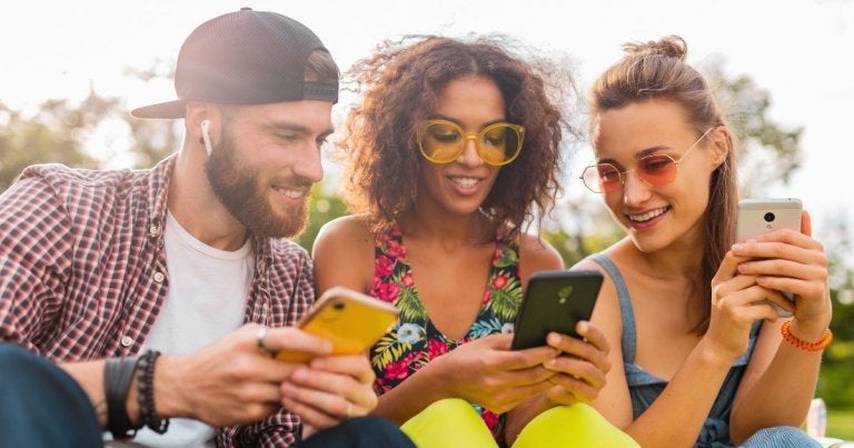 buckeye blog, summer internet usage, 3 friends smiling in the sun on phones