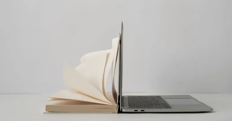 internet archive, wayback machine, image of book laying on laptop